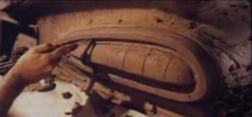 Still from &#x27;American Look&#x27; showing a car prototype being sculpted from clay.